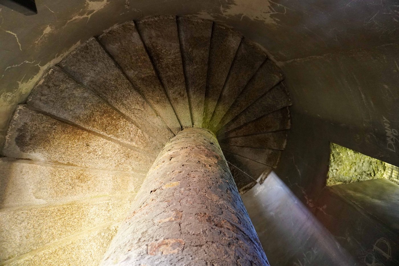 The spiral stone staircase inside Aylmer's Tower viewed from below